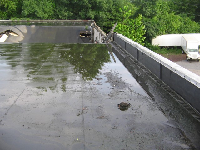 Building Collapse 6-28-2006.  Heavy rain and debris clogged roof drains caused this roof to fail.